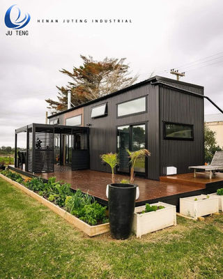 Casa de construção pré-fabricada de madeira com recipiente de aço